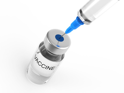 Syringe and vaccine bottle on white background