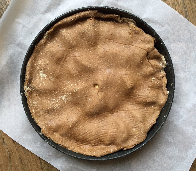 tarte tatin in a pie tin ready to go into the oven