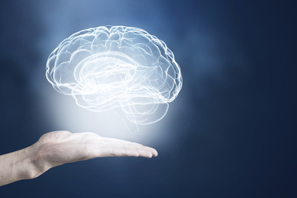 Male hands holding image of human brain