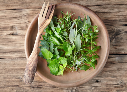 Herbs in a wooden plate