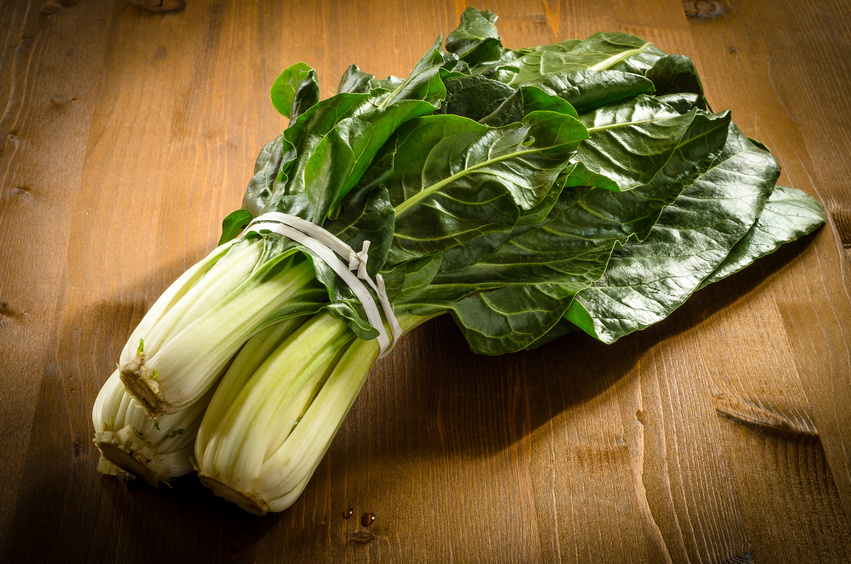 swiss chard bundle on wood table